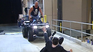 Stone Cold Steve Austin chases Mr. McMahon on an ATV
